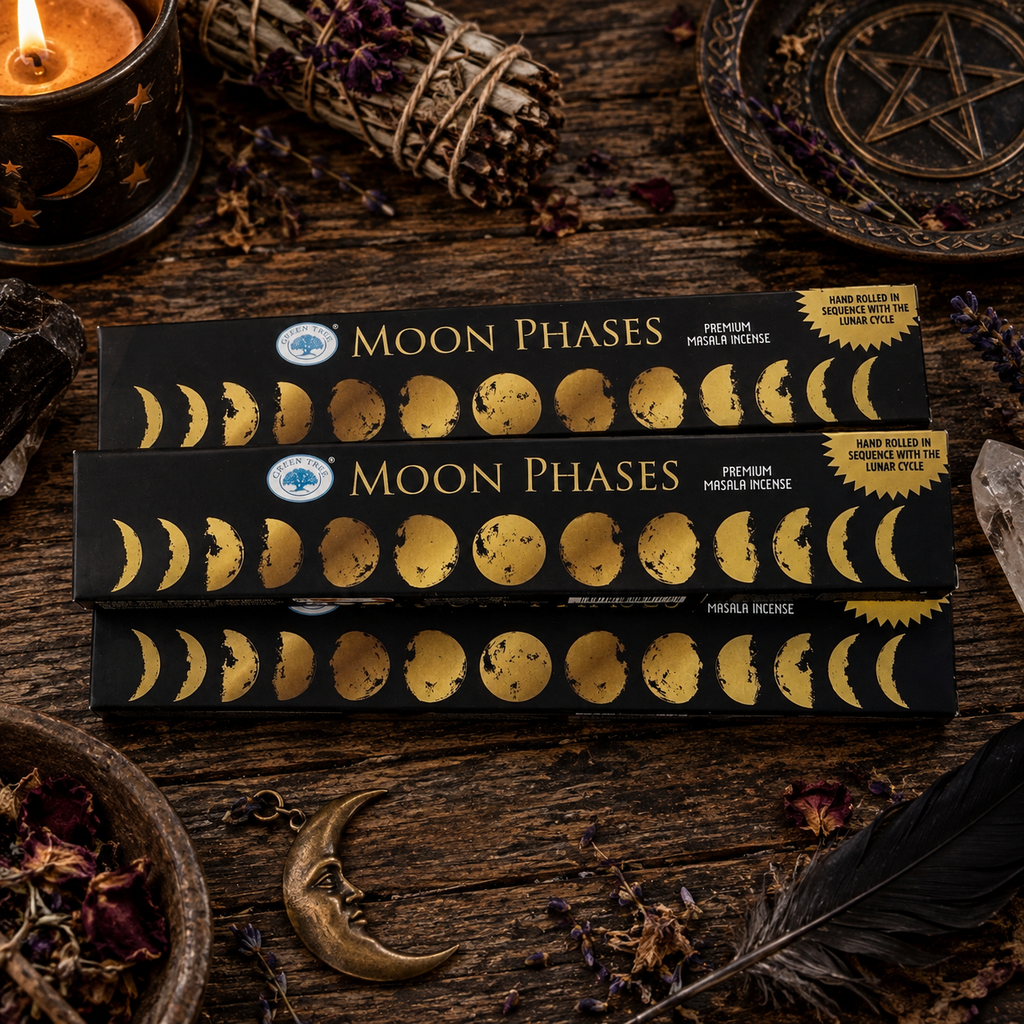 Green Tree Moon Phases premium masala incense boxes displayed in a dark lunar-inspired setting with candle, herbs and moon decor.