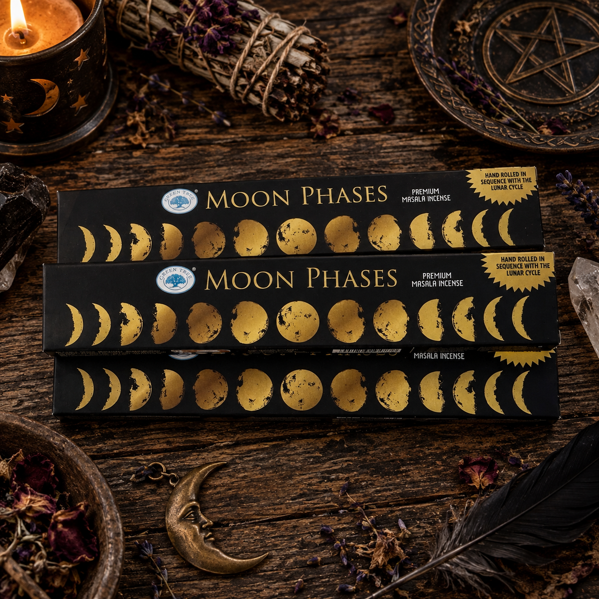 Green Tree Moon Phases premium masala incense boxes displayed in a dark lunar-inspired setting with candle, herbs and moon decor.
