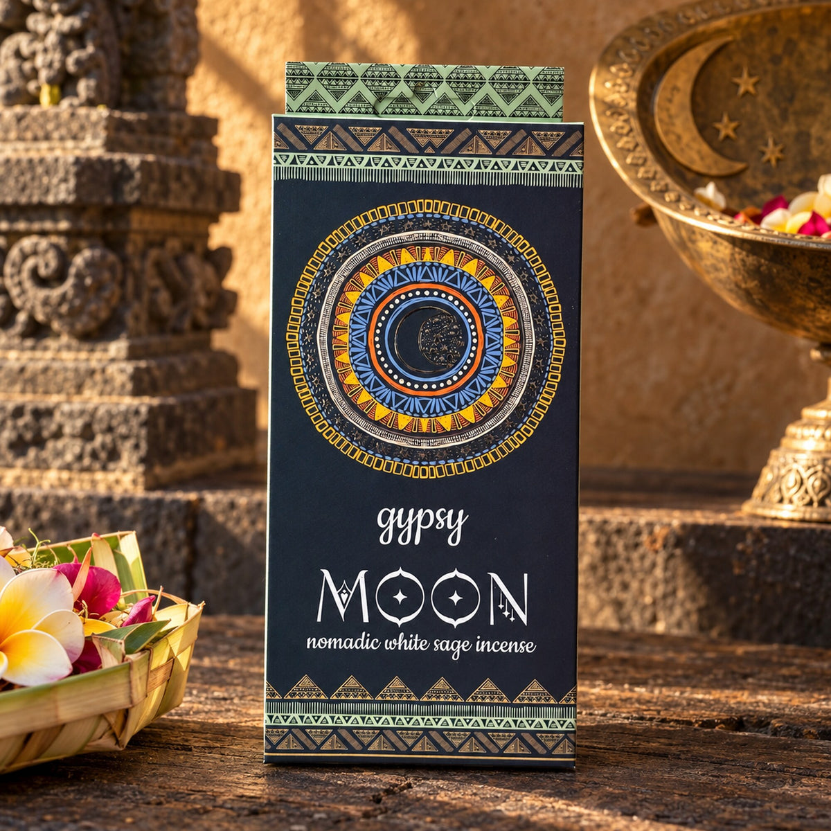 Gypsy Moon Nomadic White Sage incense package displayed in a warm bohemian ceremonial-inspired setting.