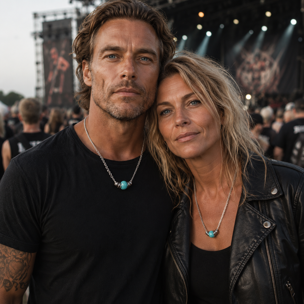 Couple wearing handmade blue stone pendant necklaces at an outdoor music festival