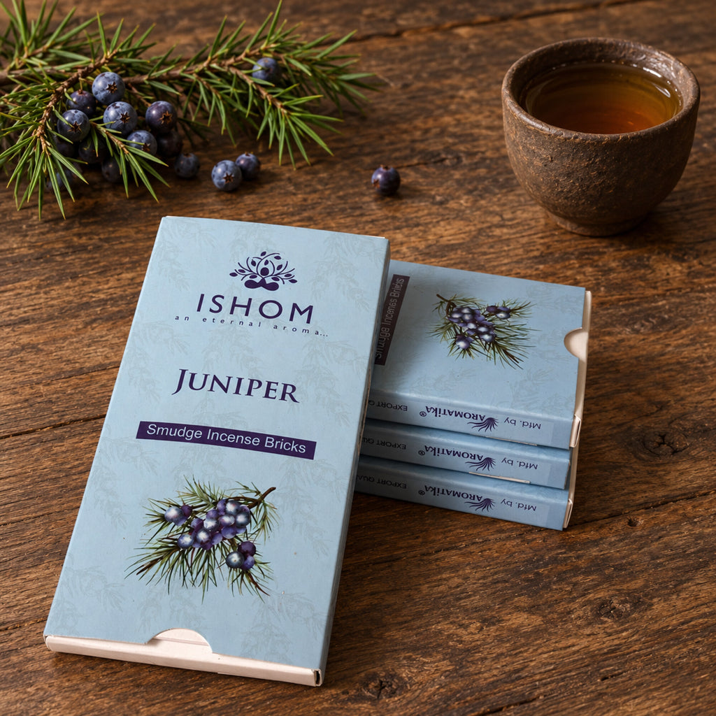 ISHOM Juniper smudge incense bricks in light blue packaging with juniper branches and berries