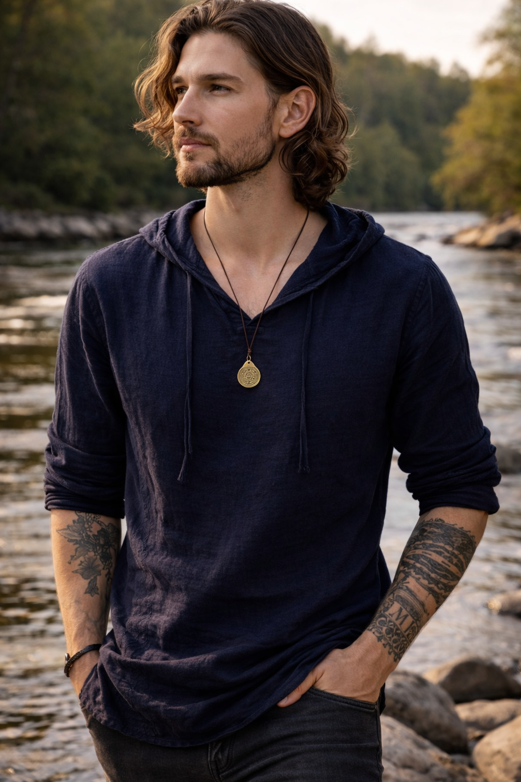 Model wearing an antique-gold-tone labyrinth symbol pendant necklace on a brown cord