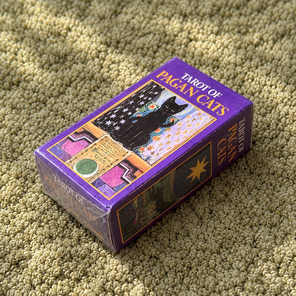 Tarot of Pagan Cats tarot deck in purple illustrated box shown at an angle